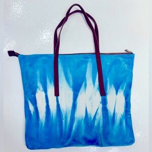 Brand New, never been worn Genuine Lamb skin tote in a turquoise tie dye
